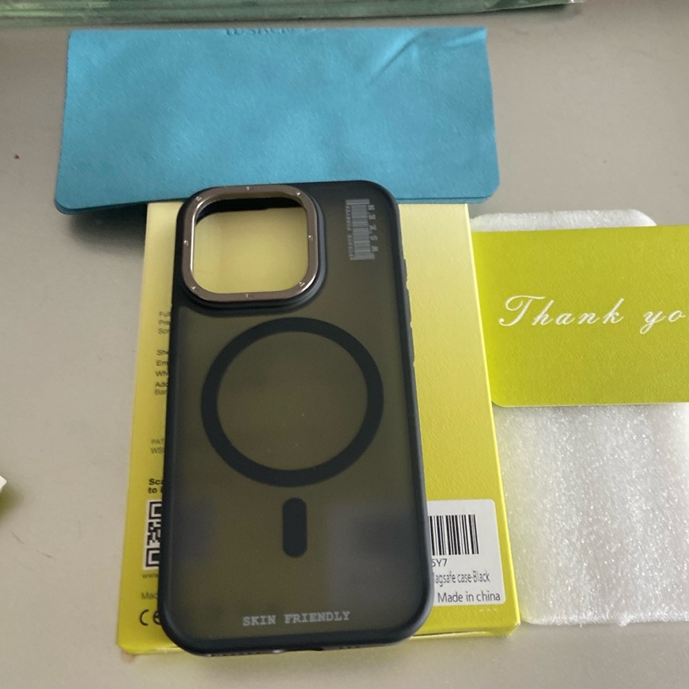 iPhone 15 pro case titanium included with a cloth screen cleaner